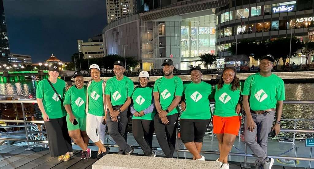 Strategic Performance Monitoring & Evaluation in Singapore – Risalat Group at Strategic Performance M&E Training in Singapore, wearing green shirts with a logo.