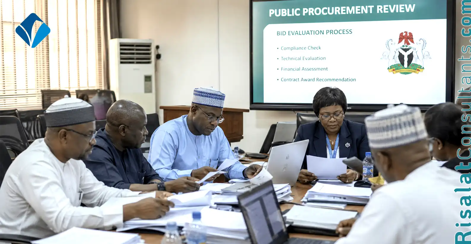 Government procurement reform meeting reviewing public procurement contracts and bid evaluation